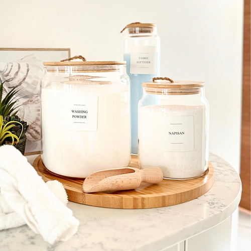 Five-piece bamboo and glass laundry storage set with liquid jar