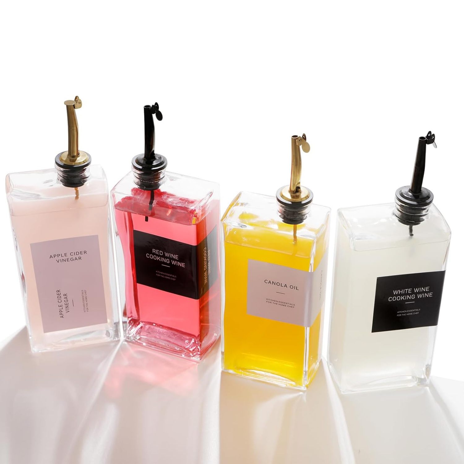 Two book-style glass oil and vinegar dispenser bottles, 500ml